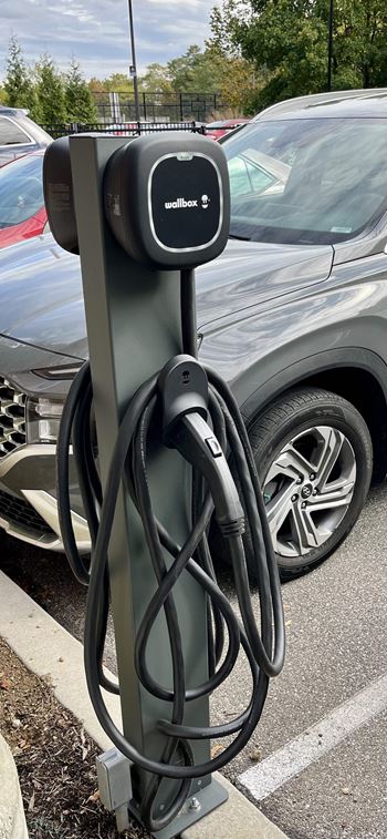 A charging station for a car at a parking lot